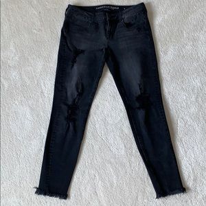 Mid rise black ripped jeans
